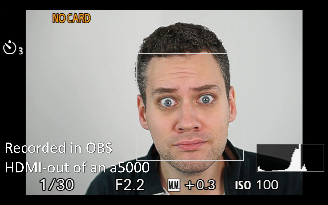 Recording from the a5000 showing an image of me looking into the camera. The image is grainy and has a user interface.