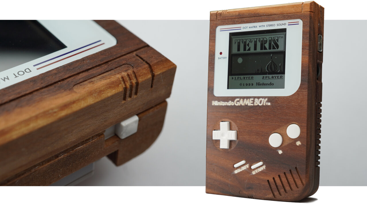 Thumbnail of the youtube video: The center shows a Game Boy with a dark wooden shell, white buttons and a white screen bezel. Its display shows the title screen of Tetris. Left of the Game Boy is a dark wooden Game Boy cartridge with a carved label reading Pokemon Walnut Version. To the right there is a brighter wooden cartridge with a label reading Pokemon Oak Version.